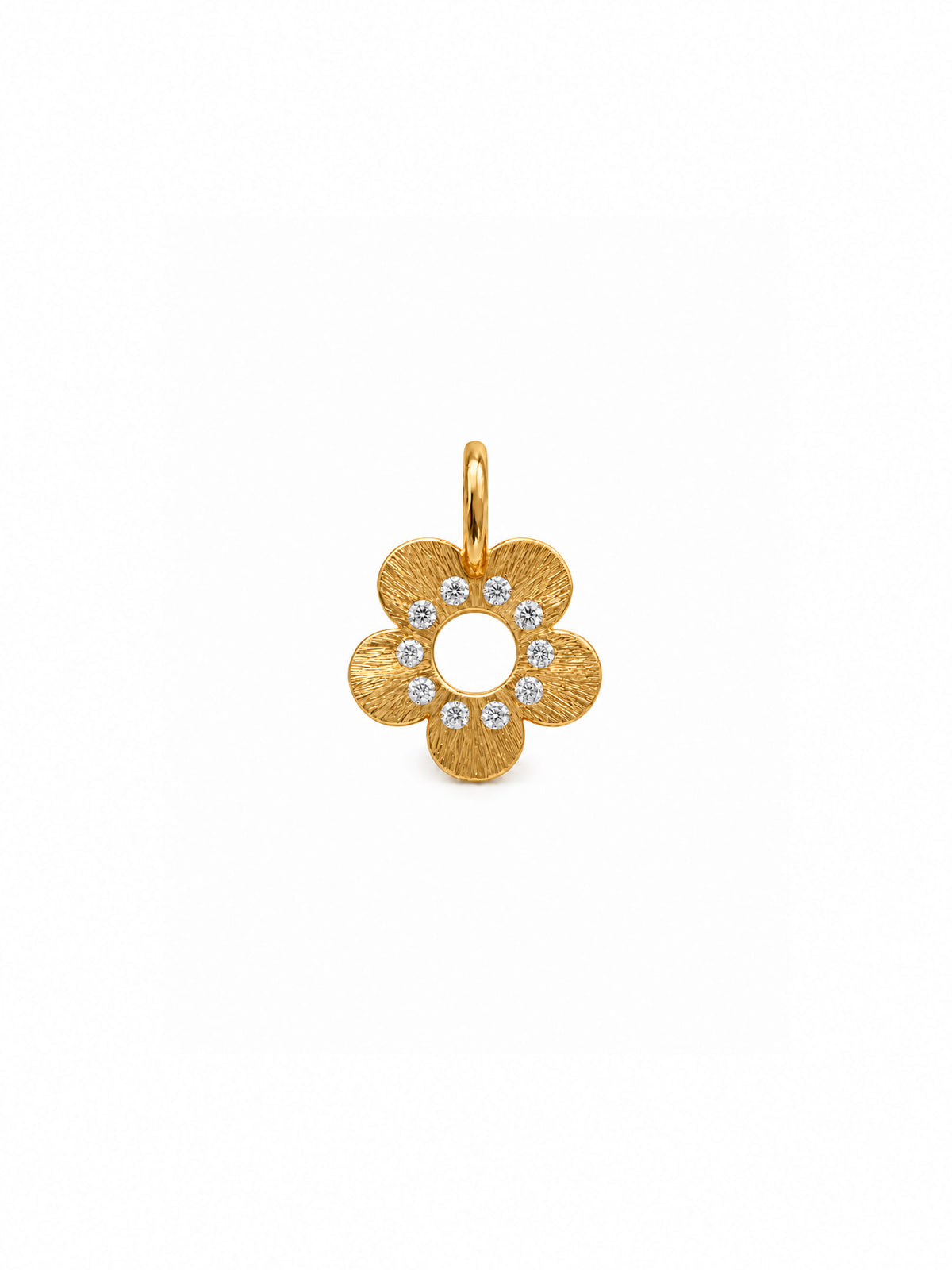 A gold flower-shaped pendant charm with a textured finish and a ring of small clear stones in the center, shown on a plain white background.