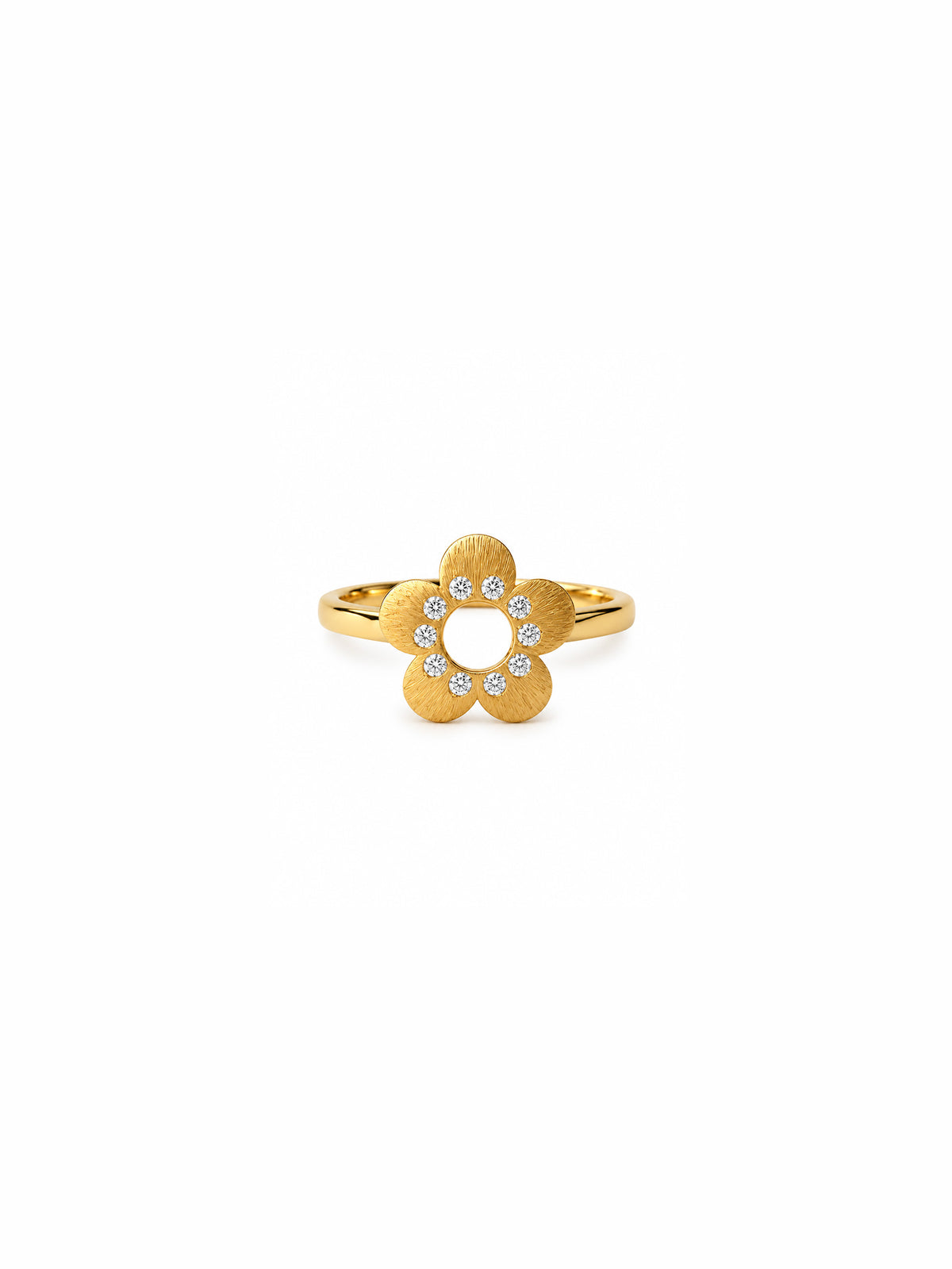 A gold flower-shaped ring with a textured finish and a halo of small clear stones in the center, shown on a plain white background.