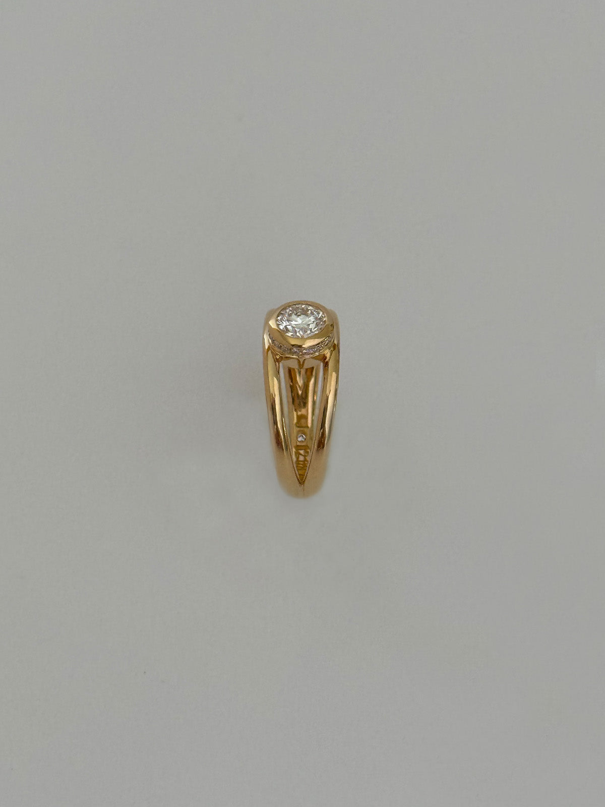 Trine - Ring with a 0.53 carat center diamond surrounded with halo brilliant-cut diamonds