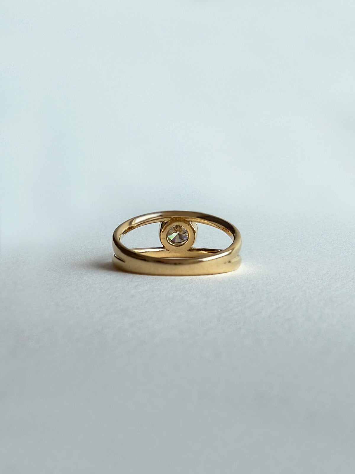 Trine - Ring with a 0.53 carat center diamond surrounded with halo brilliant-cut diamonds