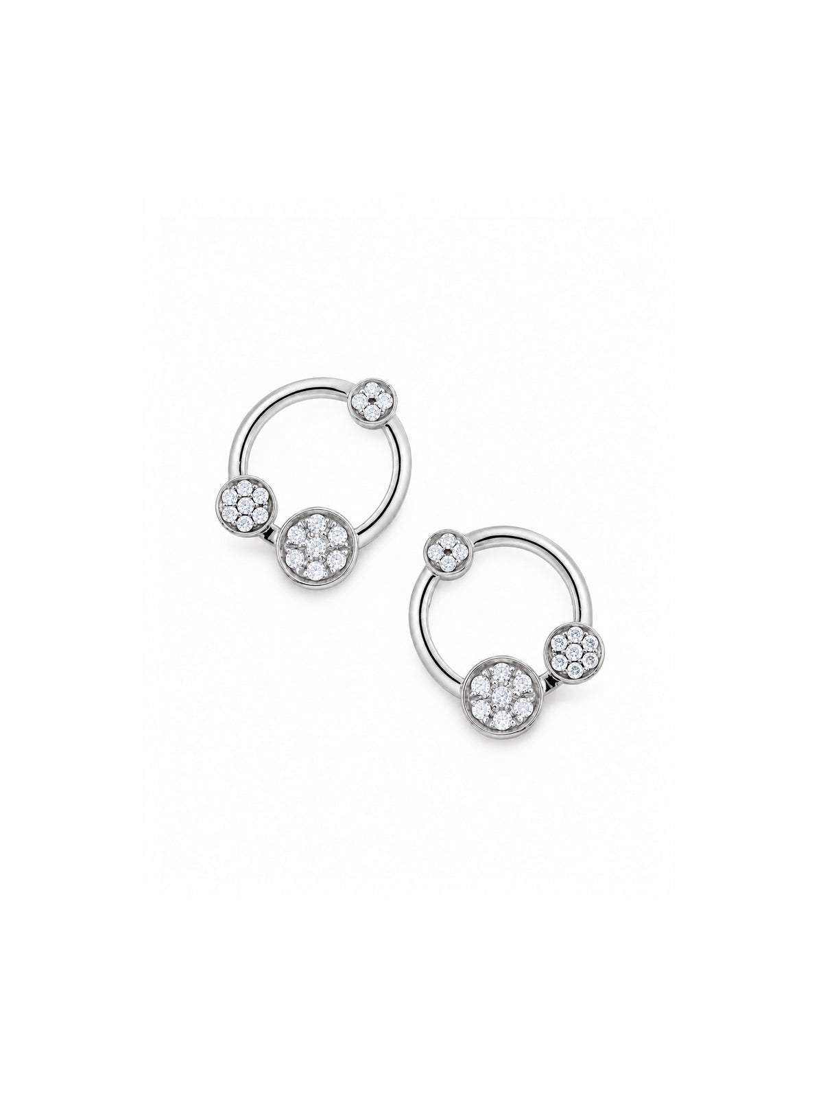 A pair of 18k whitegold huggie hoop earrings adorned with pavé-set diamond stones