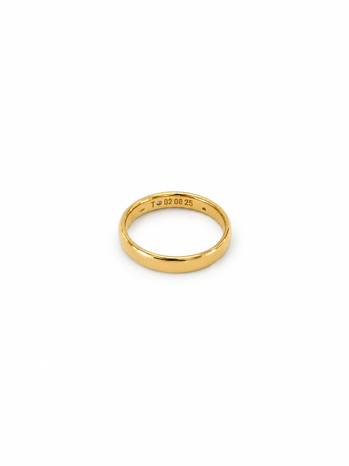 A simple yellow gold band ring with a polished finish, shown from the inside to display the sterling silver 09.00.