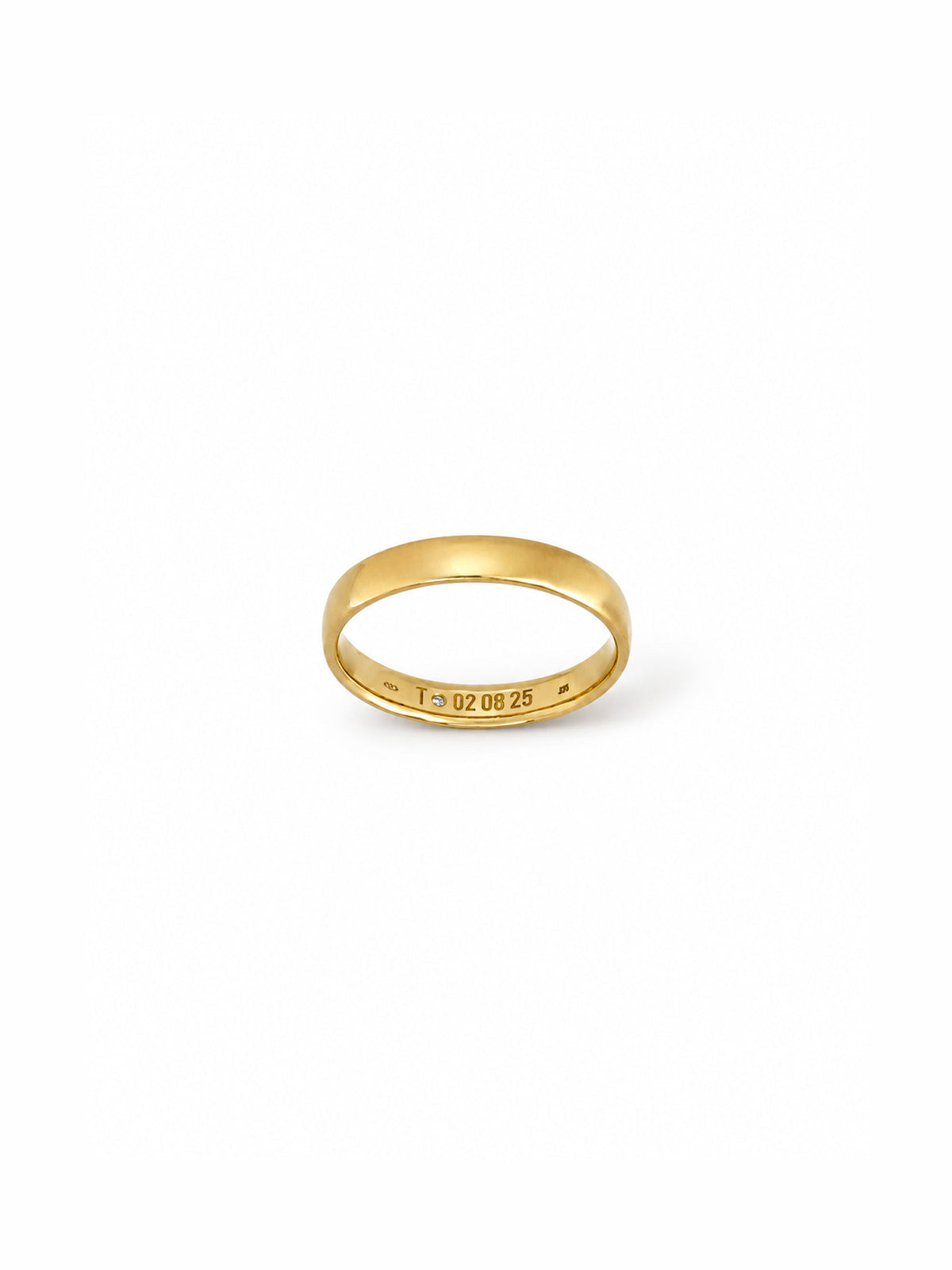 A simple yellow gold band ring with a small engraved date '1.02.08.25' on the inside, shown on a clean white background.