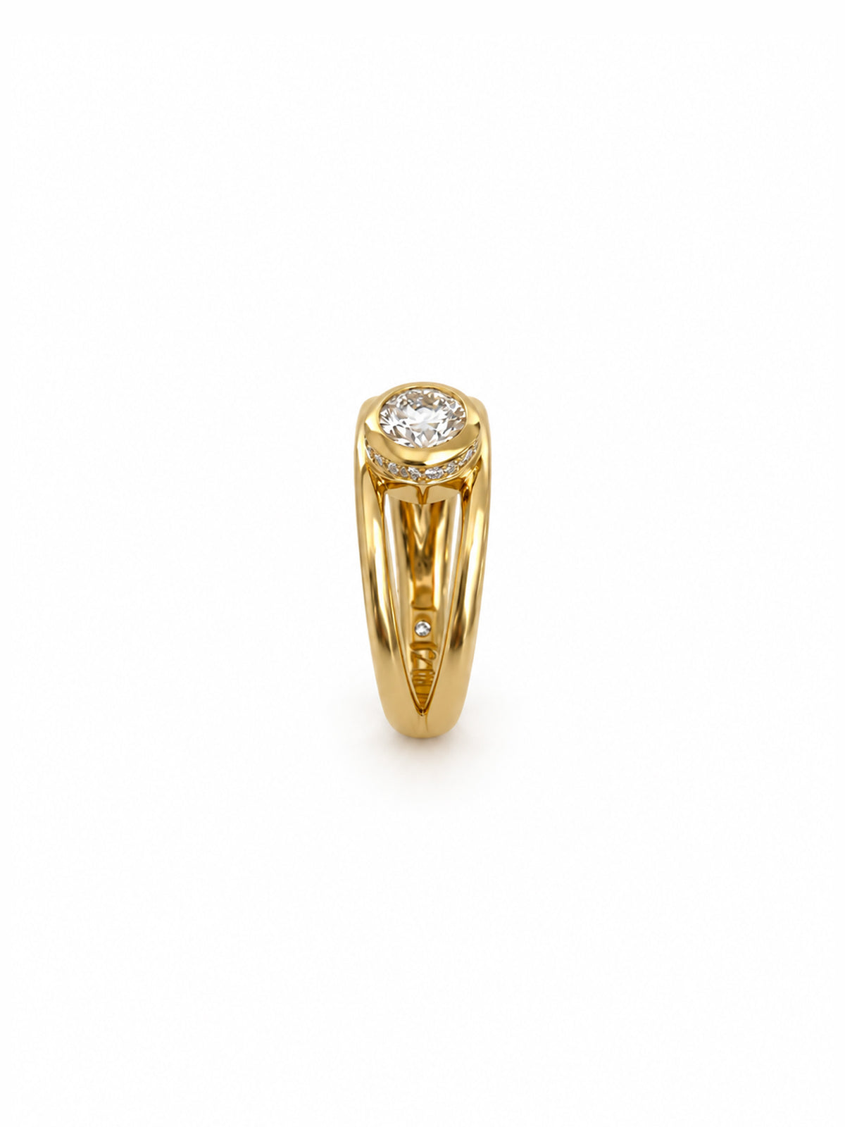 A yellow gold ring featuring a round-cut clear gemstone in a prong setting, with a small inset diamond on the band, shown against a plain white background.